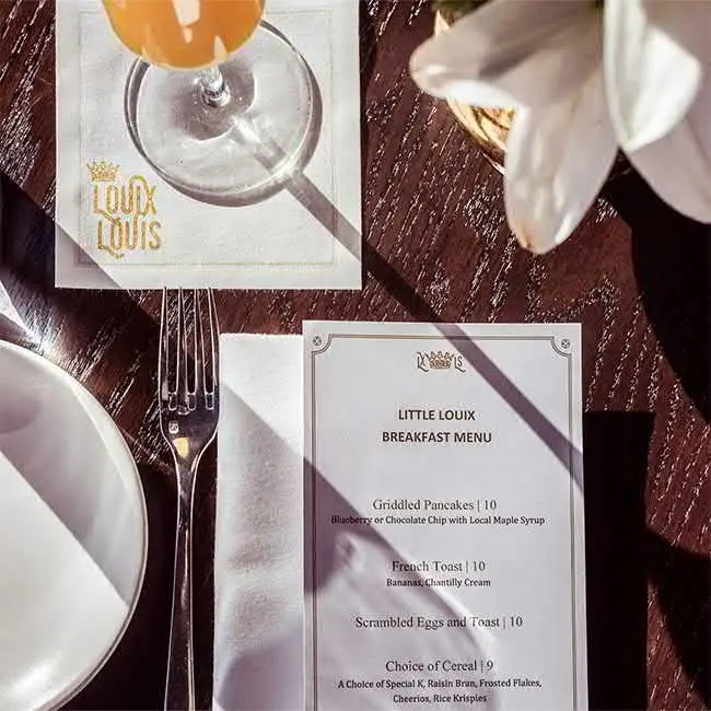 Little Louix Breakfast Menu: An Elegant Dining Experience Elegant breakfast setting featuring the Little Louix menu, a luxury dining experience by Navigate Living.