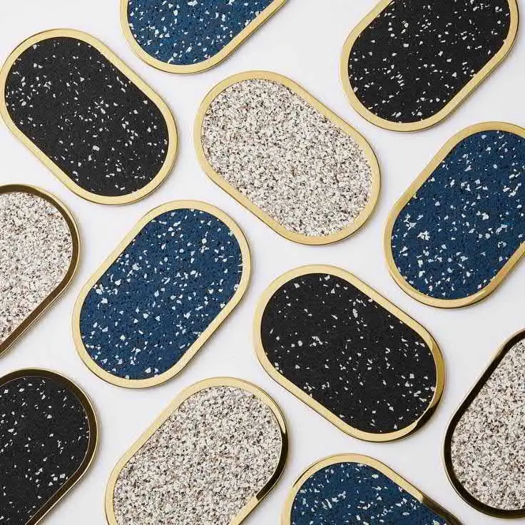 Collection of modern terrazzo-patterned home décor trays with gold accents, showcasing Thirty Six Knots’ curated home accessories.