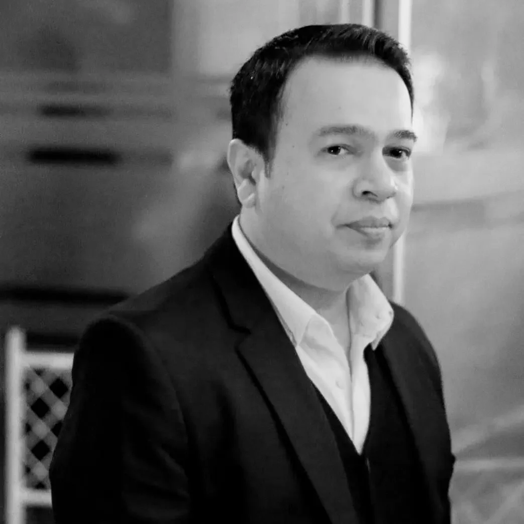 Anwar Ali - Head of Technology & Development Black and white portrait of Anwar Ali, Head of IT at OHS Global.